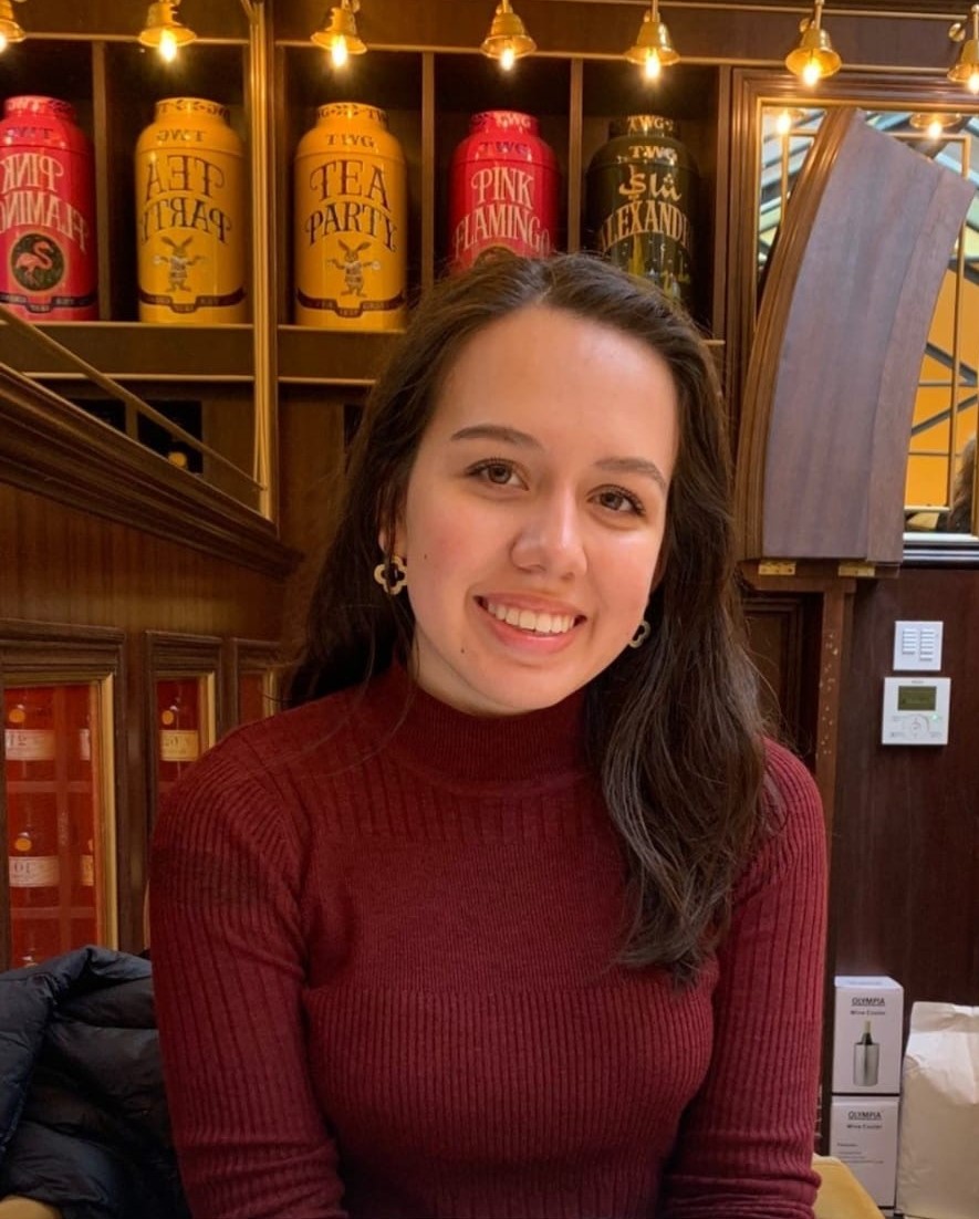 Photo of Sofia in front of some tea containers