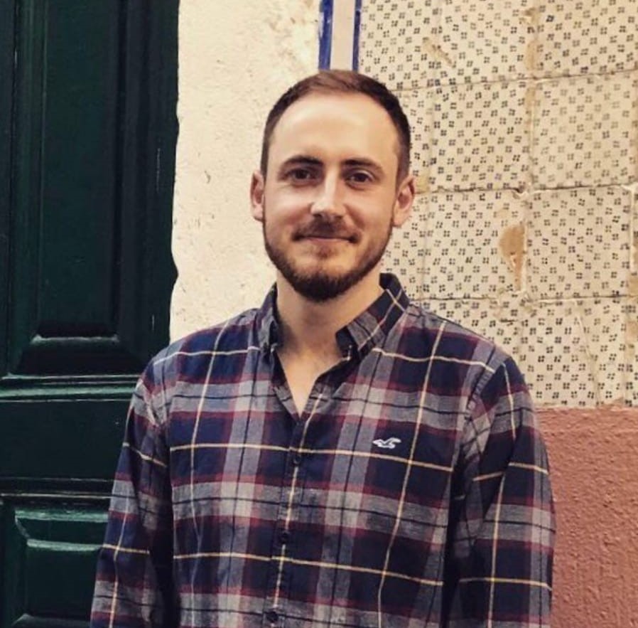 Conor H picture standing in front of a wall