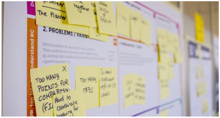 Product mapping sticky note exercise on a wall
